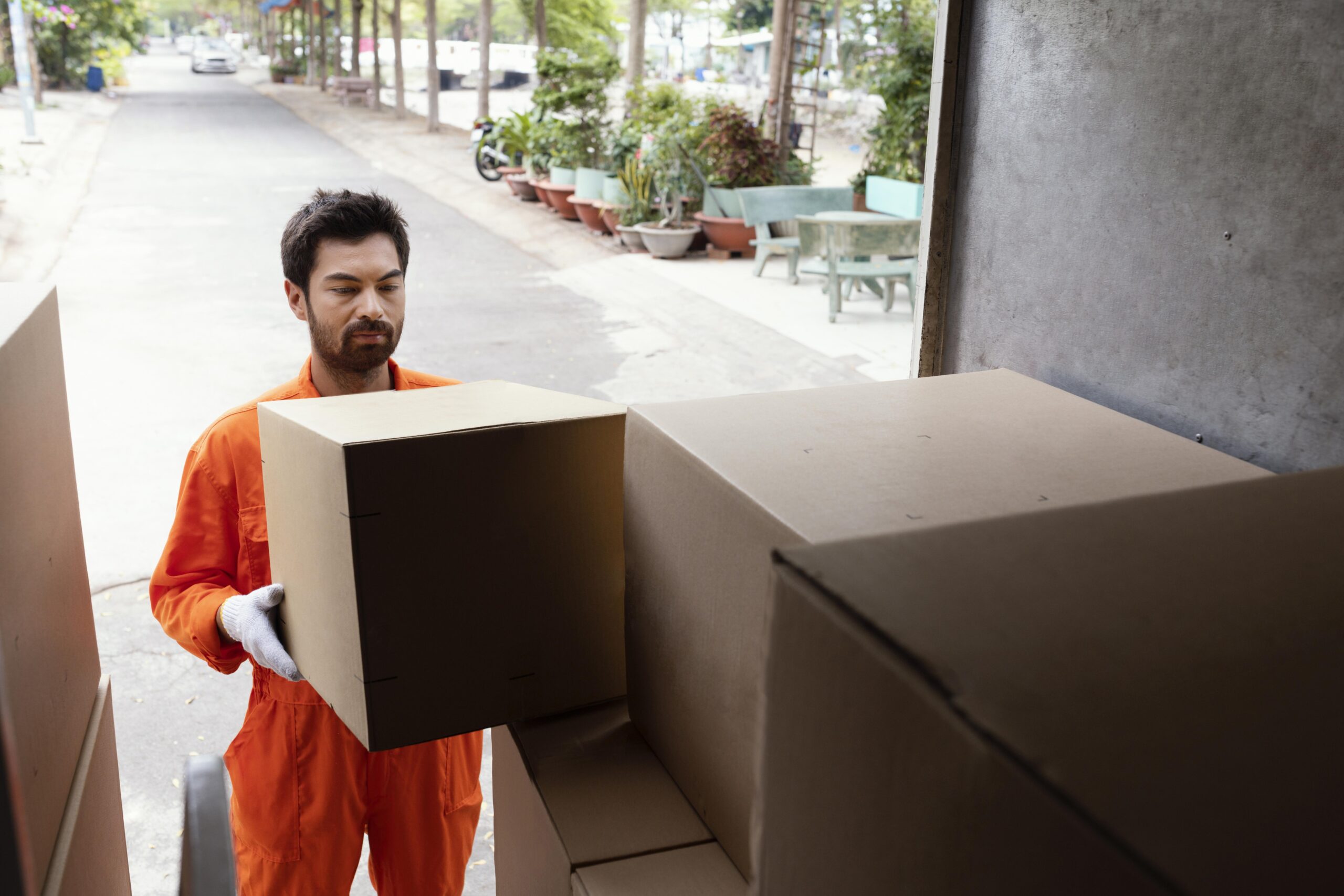 delivery-man-loading-car-with-delivery-boxes